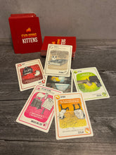 Load image into Gallery viewer, The cards are shown here. The cards have the flavor text in braille for the game instead of the full text of the card function. The card function is embossed on reference sheets since there are very few of them and you learn them very quickly. This is a picture of the family friendly version of the game instead of the NSFW version.