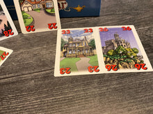 Load image into Gallery viewer, face up cards with houses and numbers on them. All cards have braille stickers on them.
