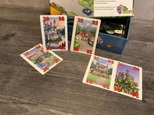 Load image into Gallery viewer, face up cards with houses and numbers on them. All cards have braille stickers on them.