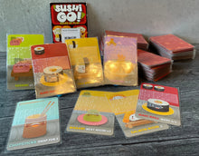 Load image into Gallery viewer, A shot of the cards from sushi go. All cards have transparent braille on them