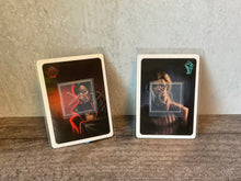 Load image into Gallery viewer, Spy and Resistance loyalty cards. Shows how they can be determined even if you don't know braille