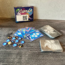 Load image into Gallery viewer, Hanabi laid out. The cards have transparent braille on them and the fuse tokens have braille on them as well.