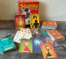 Load image into Gallery viewer, Sleeping queens. All the cards have transparent braille on them. The king cards have braille on the back as well to distinguish them
