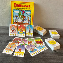 Load image into Gallery viewer, Bohnanza with the accessibility kit applied to it. Various beans can be seen with all the vital stats on the cards in braille.