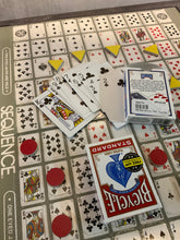 Load image into Gallery viewer, Closer shot of the board with the thermoformed overlay. Yellow triangle tokens and red circles can be seen on the board