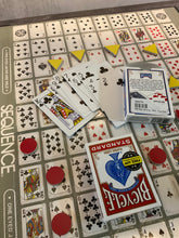 Load image into Gallery viewer, Closer shot of the board with the thermoformed overlay. Yellow triangle tokens and red circles can be seen on the board