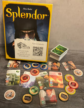 Load image into Gallery viewer, Shot of the Splendor game. Tokens with braille on them, the noble cards with transparent braille on them, and the game cards also have transparent braille on them.