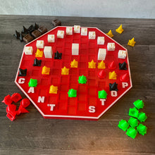 Load image into Gallery viewer, A shot of the can't stop board. 3d printed toppers cover the print numbers and add braille and print to them. New tactile pieces are present in 4 different colors, each with a unique shape.