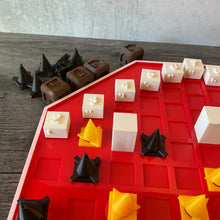 Load image into Gallery viewer, A close up of the dice that are included, the toppers and the large square play pawns.