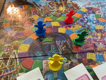 Load image into Gallery viewer, Close up on the 3d printed replacement pieces. The thermoformed overlay can be seen along with the braille on the spaces indicating the colors. Each replacement piece has a shape on it that corresponds to the color.