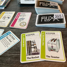 Load image into Gallery viewer, A close up on the keeper cards the rocket and toaster. The braille is transparent on the cards.