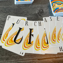 Load image into Gallery viewer, A close up of the cards with the braille on them. The word purchase is spelled out.