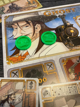 Load image into Gallery viewer, A shot of the 3d printed bag replacement tokens sitting on the player mat. These are 3d printed because the original pieces were too small for even 2 braille cells.