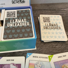 Load image into Gallery viewer, A picture of the backs of the two types of cards. Both have QR cards but the white baby cards also have a braille sticker on the back to help separate them