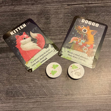 Load image into Gallery viewer, Close up on the doggo and kitten cards. two tokens are also shown