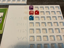 Load image into Gallery viewer, A close up on the trays. There are 6 slots for dice in each row. The main game only supports 4 players, but 8 can play if you have both red and purple.