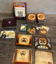 Load image into Gallery viewer, A picture showing the box, and all of the different types of cards that are in the game.