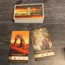 Load image into Gallery viewer, The parks deck with 2 parks face up in front of it. the name of both parks are in braille along with the type of landscape