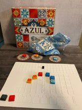 Load image into Gallery viewer, A shot of the Azul box with one of the thermoformed replacement boards with tiles on it. Each tile has a transparent braille sticker on them.