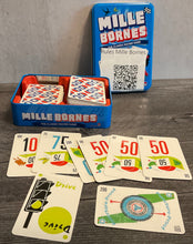 Load image into Gallery viewer, The game with a series of number cards laid out. Drive is in front and the puncture proof card is laid out horizontally indicating that it was used as a bonus.
