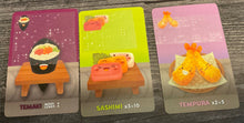 Load image into Gallery viewer, Tamaki, Sashimi and tempura cards laid out. All 3 have braille on them.