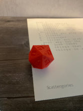 Load image into Gallery viewer, A close up shot of the 3d printed die and one of the lists.