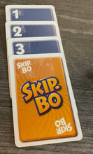 Load image into Gallery viewer, A sequence of cards 1-4, with the 4 being replaced with a skip-bo card.