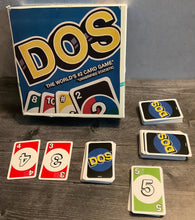 Load image into Gallery viewer, The Dos cards set out. All the cards have transparent braille on them.