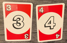 Load image into Gallery viewer, The red 3 and 4 with transparent braille on them.