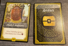 Load image into Gallery viewer, A close up view of the front and the back of artifact cards. Braille is on both sides to help separate it from the other decks