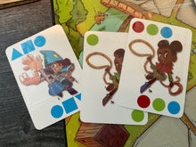 Load image into Gallery viewer, Close up on some of the game cards. They all have braille and tactile shapes on them
