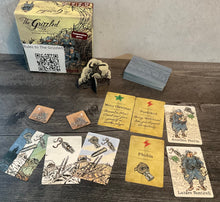 Load image into Gallery viewer, The grizzled with the different types of cards laid out in front of it.
