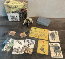 Load image into Gallery viewer, The grizzled with the different types of cards laid out in front of it.