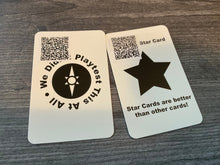 Load image into Gallery viewer, The back of two cards. They both have QR codes on them but the star card also has transparent braille on it saying star