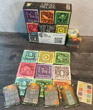 Load image into Gallery viewer, The board, the box, the cards laid out. All have transparent braille on them