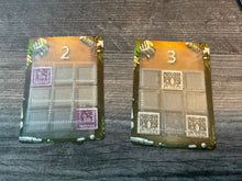 Load image into Gallery viewer, The cards showing the needed layouts tactilely and the point values awarded for completing them.