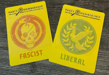 Load image into Gallery viewer, The facist and liberal party membership cards. The fascist has a tactile x and the liberal has a tactile circle