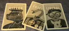 Load image into Gallery viewer, The role cards. They all have tactile shapes on them. The Hitler has a swastika, the fascist has an x on it, and the liberal has an o on it.