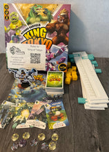 Load image into Gallery viewer, The game with the accessibility kit. Tokens with braille, plastic replacement sliders for tracking stars and hp, replacement 3d dice and cards with braille on them.