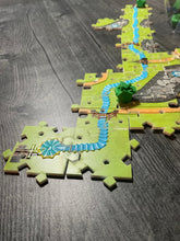 Load image into Gallery viewer, close up of the river showing the cross to represent the cathedral and the wavy river that can be felt