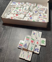 Load image into Gallery viewer, A shot of the box showing all of the included tiles. Some of the tiles are stacked in front of the box.