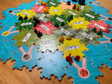 Load image into Gallery viewer, Wide shot of modular board. The board hexes are lasercut from acrylic with UV printed braille and textures. Places at the edge of the tiles allow the 3d printed pieces to fit securely and not scatter when touched.