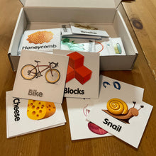 Load image into Gallery viewer, Box is open showing the tactile memory cards. A bike and a snake is in the forefront.