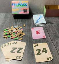 Load image into Gallery viewer, A picture of the game with the cardboard tokens laid out and some of the cards presented in front.