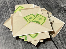 Load image into Gallery viewer, A close up of the contract cards which look like envelopes with cash sticking out of them.