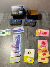 Load image into Gallery viewer, A distance shot of Towering's box and the cards.