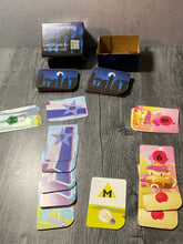 Load image into Gallery viewer, A distance shot of Towering's box and the cards.