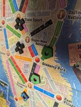 Load image into Gallery viewer, Close up on clean board overlay with replacement taxi tokens on them.