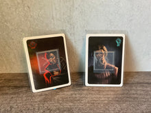 Load image into Gallery viewer, Spy and Resistance loyalty cards. Shows how they can be determined even if you don't know braille
