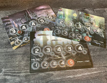 Load image into Gallery viewer, The player boards with tactile overlays on them

